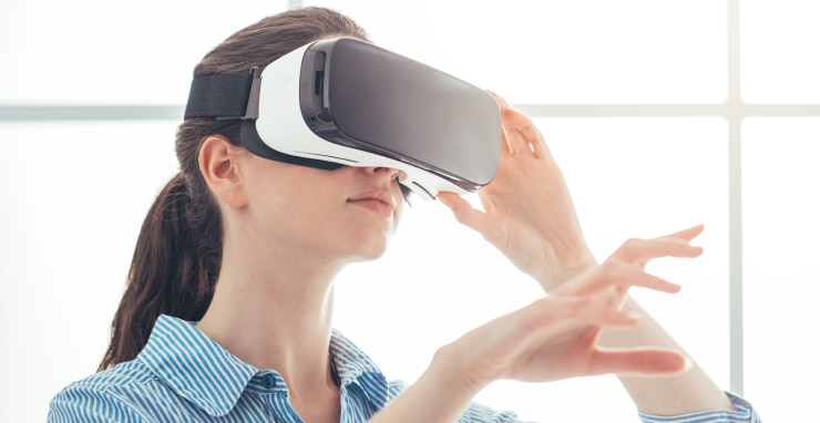 A young woman with a VR headset