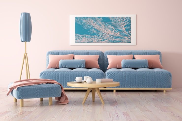 A living room designed in blue and pink colors