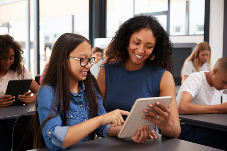 A girl with an ipad and a teacher at interior design courses