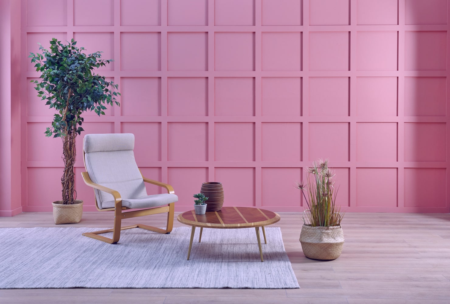 Pink-themed living room with mid-century furniture.