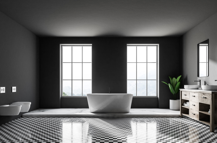 A black and white bathroom with checkered floor