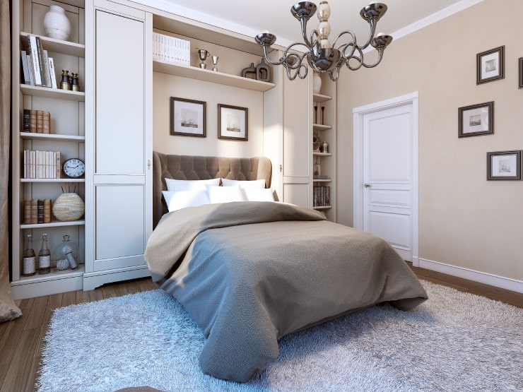 A bedroom with elegant photos on the walls