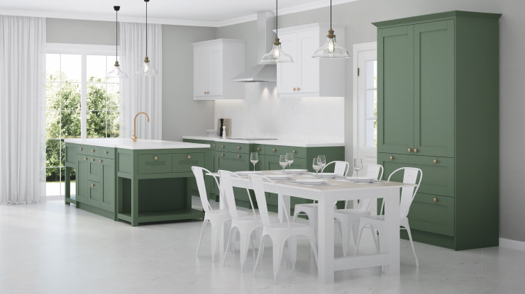 A large kitchen in white and sage green colors.
