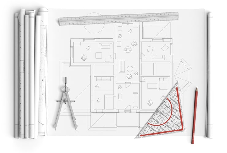 A paper floor plan with the architect’s tools
