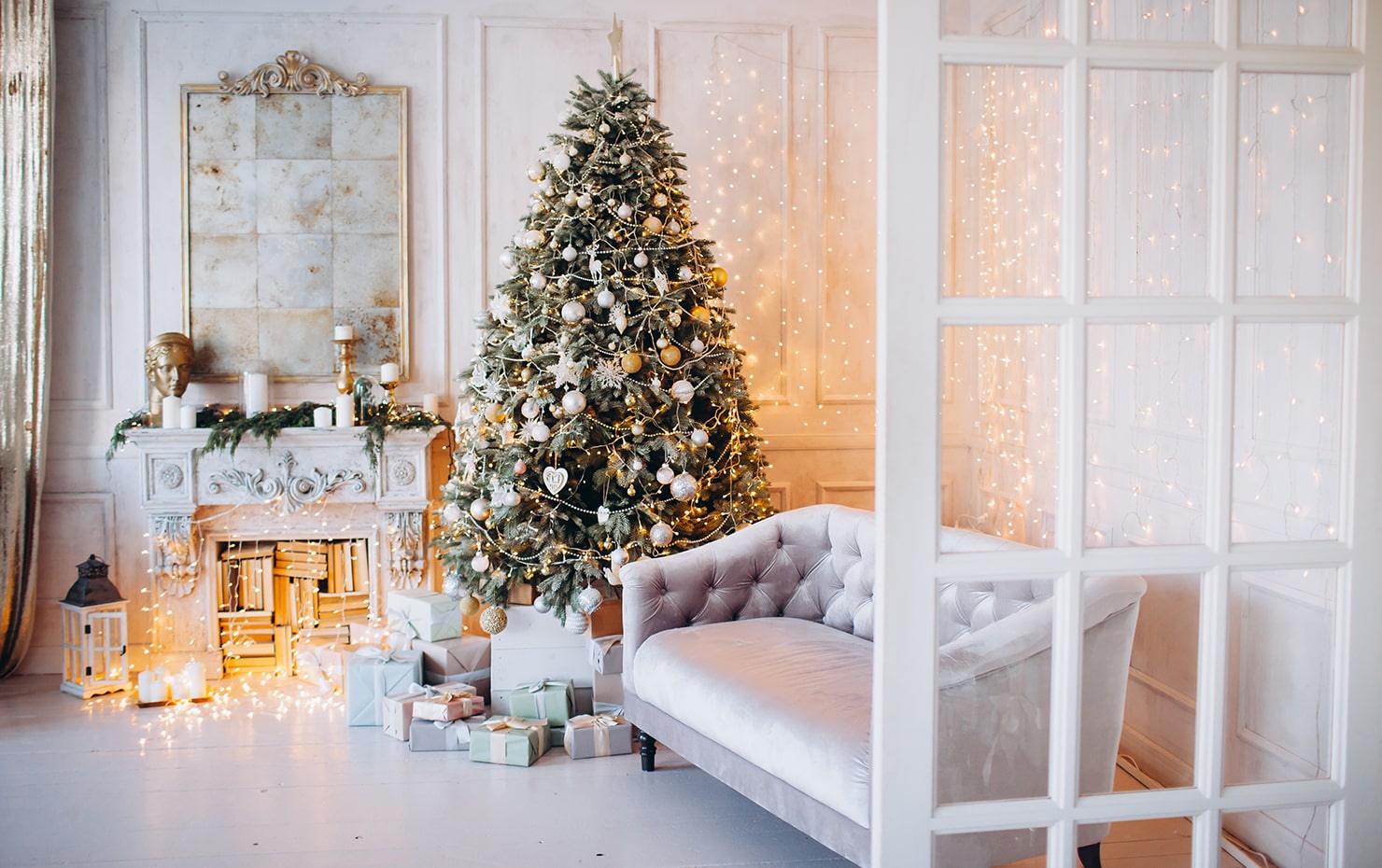 A living room decorated for Christmas in white colors.