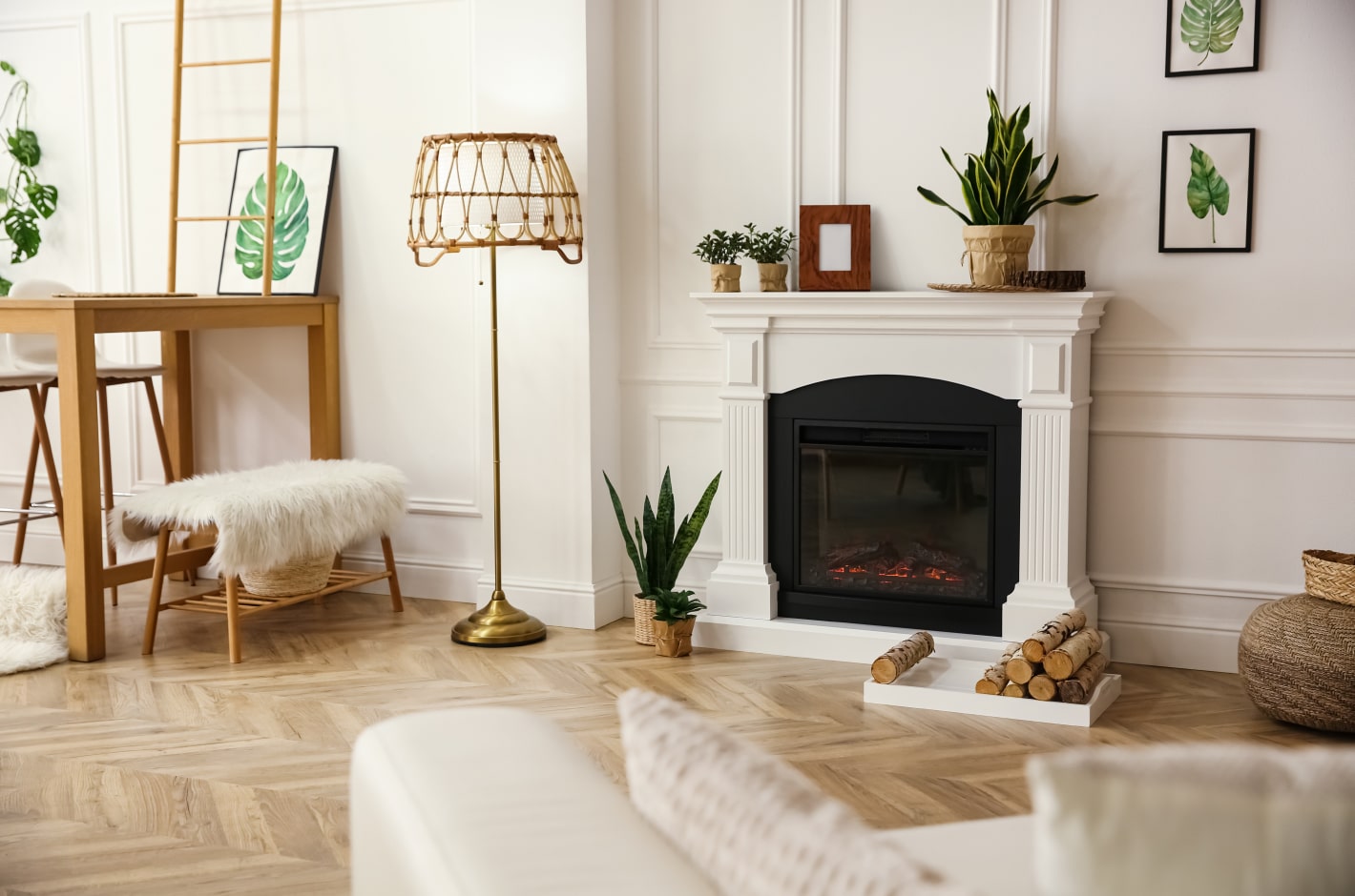 Bright living room with a fireplace, house plants and wooden decor.