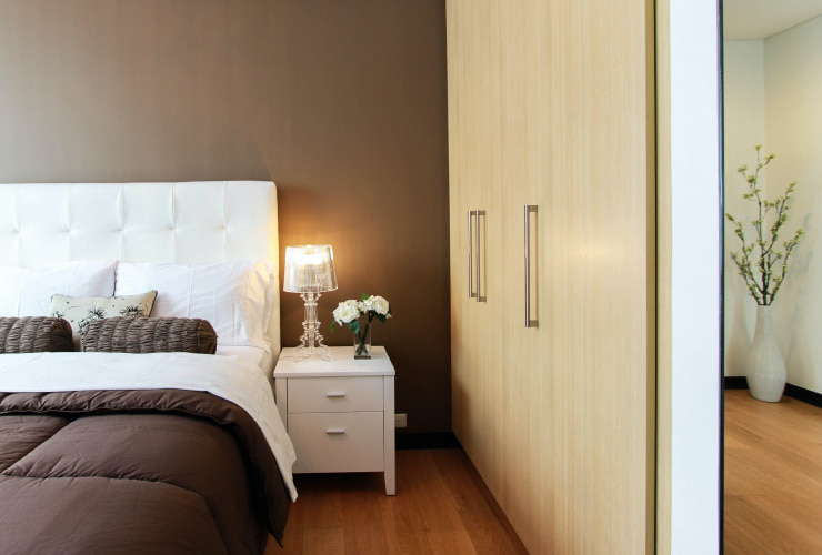 White and brown elegant master bedroom.