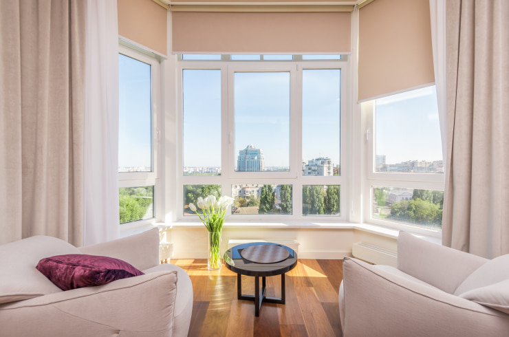 Light living room with a cityscape view.