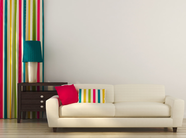 White sofa with colorful decor.