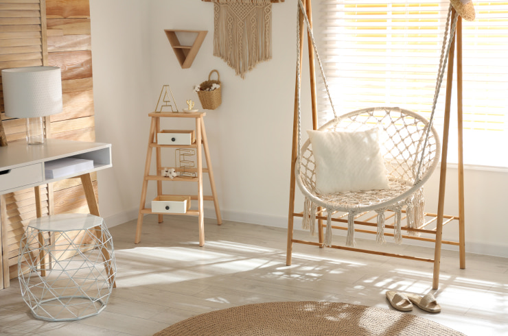 Wooden hammock chair in a modern room.