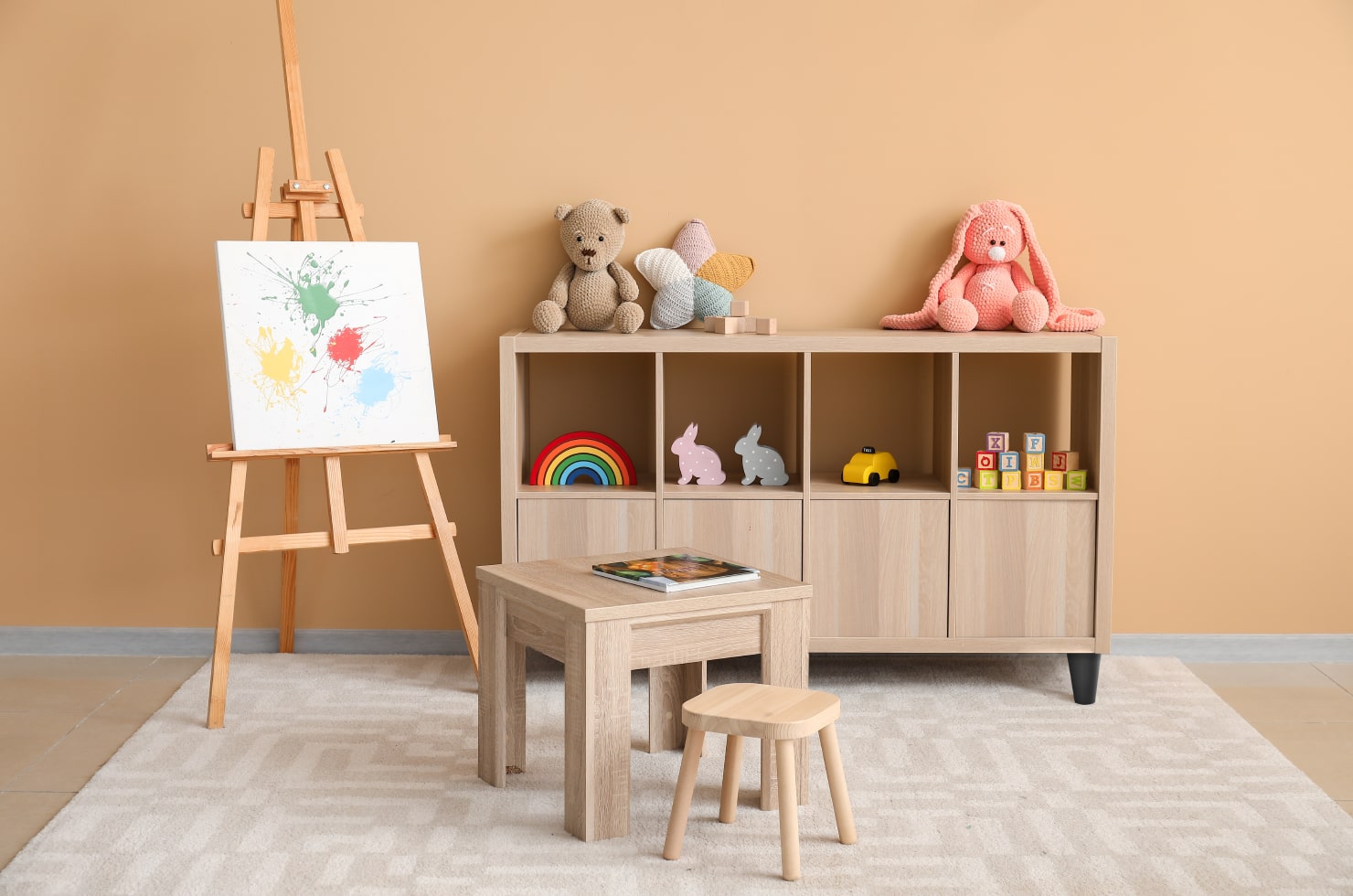Creative corner with a small easel in the kid’s room.