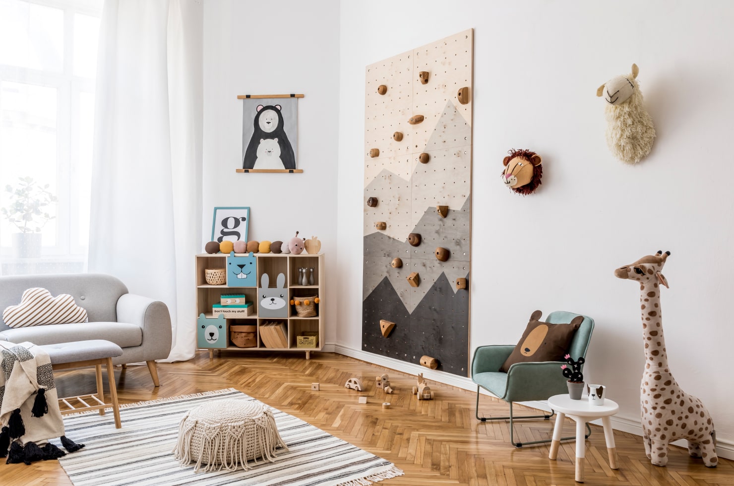 Stylish kid’s room with an indoor rock climbing wall.