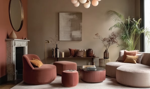 Modern living room styled according to interior design trends 2026 in the colors of muted terracotta, sandy beige and ochre.