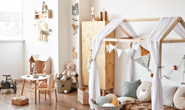 Cozy kid’s room with a bed, toys and decor.