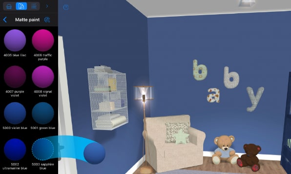 Drag and drop of color in Live Home 3D for changing a blue baby room's materials