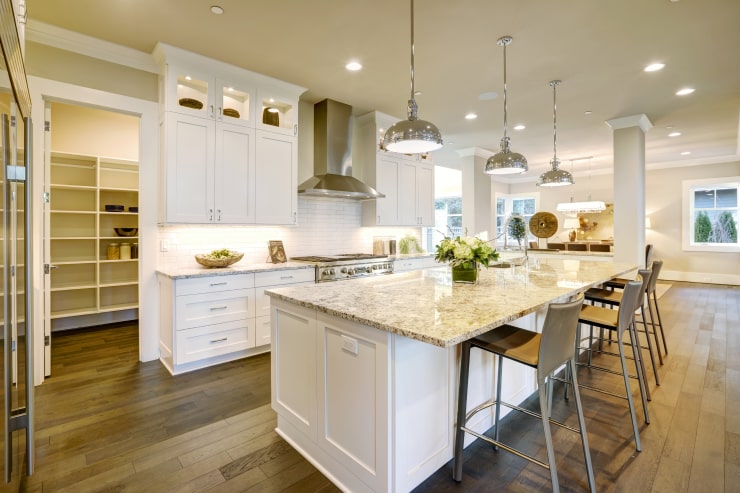 A brightly lit kitchen in light colors