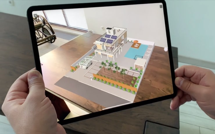A 3D model of a modern house viewed in AR (augmented reality) in Live Home 3D on an iPad