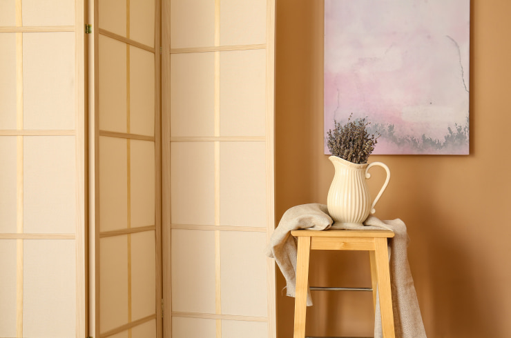 Minimalist room design with a jug used as a vase.