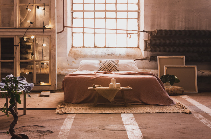 Soft bedroom design with hanging lights.