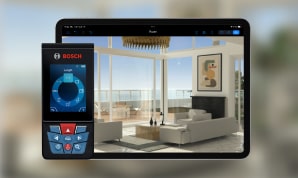 Live Home 3D home design app opened on iPad with Bosch laser measure laying beside it.
