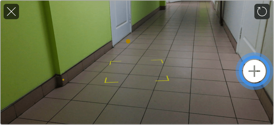 The camera of a device is pointed at the floor.